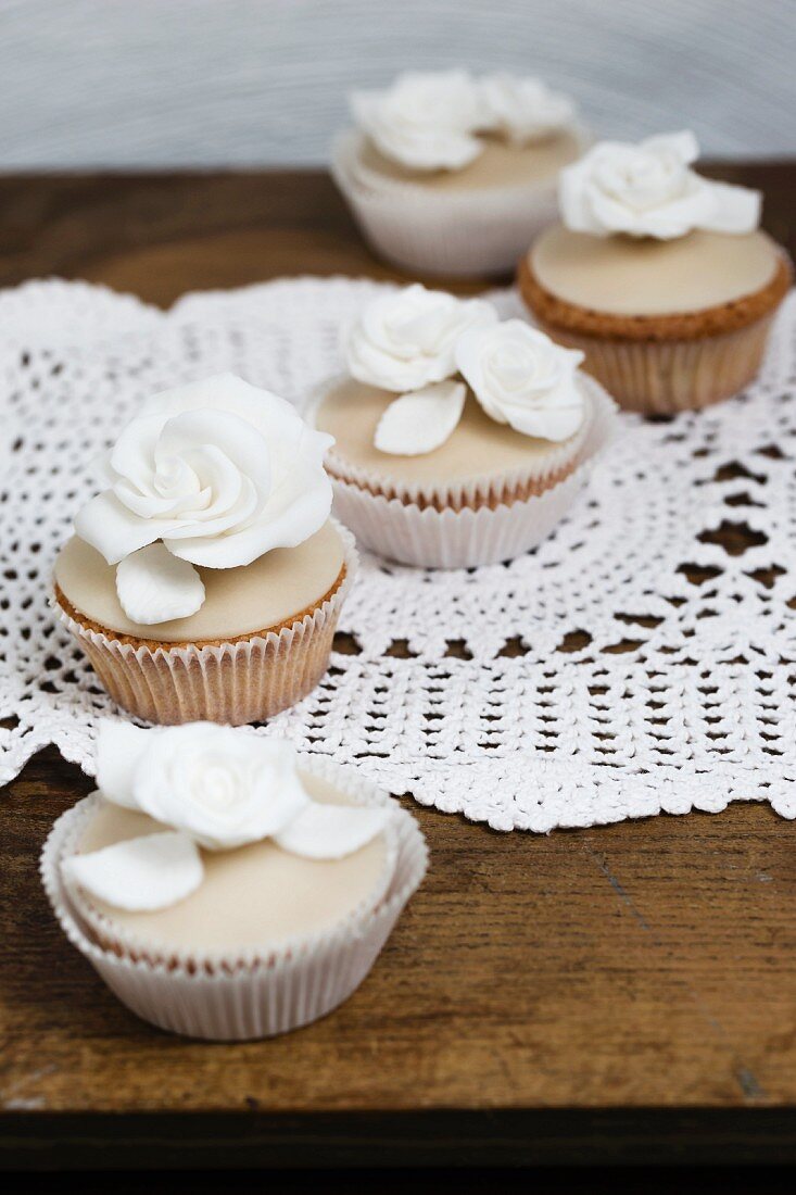 Cupcakes with white sugar roses