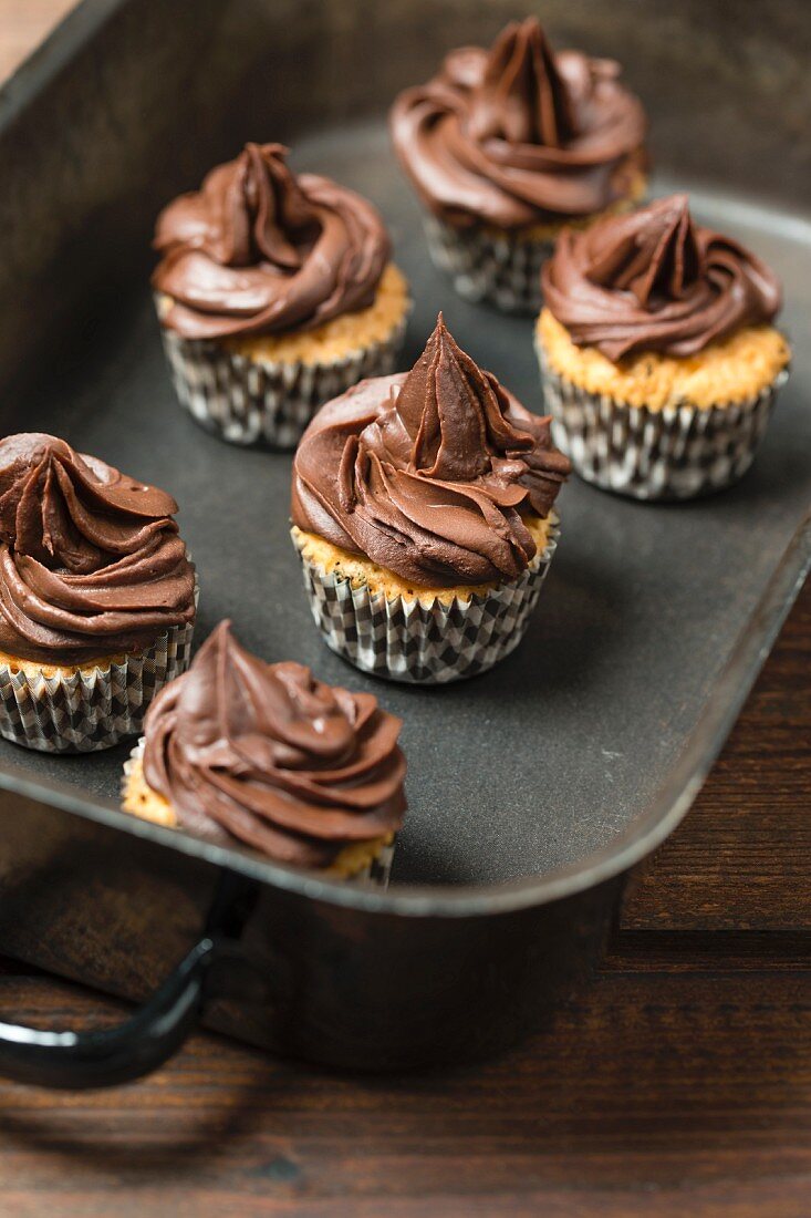 Mini cupcakes topped with chocolate ganache