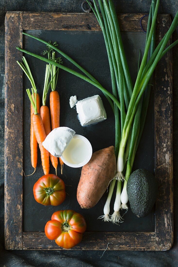 Various types of vegetables with yoghurt and goat's cheese