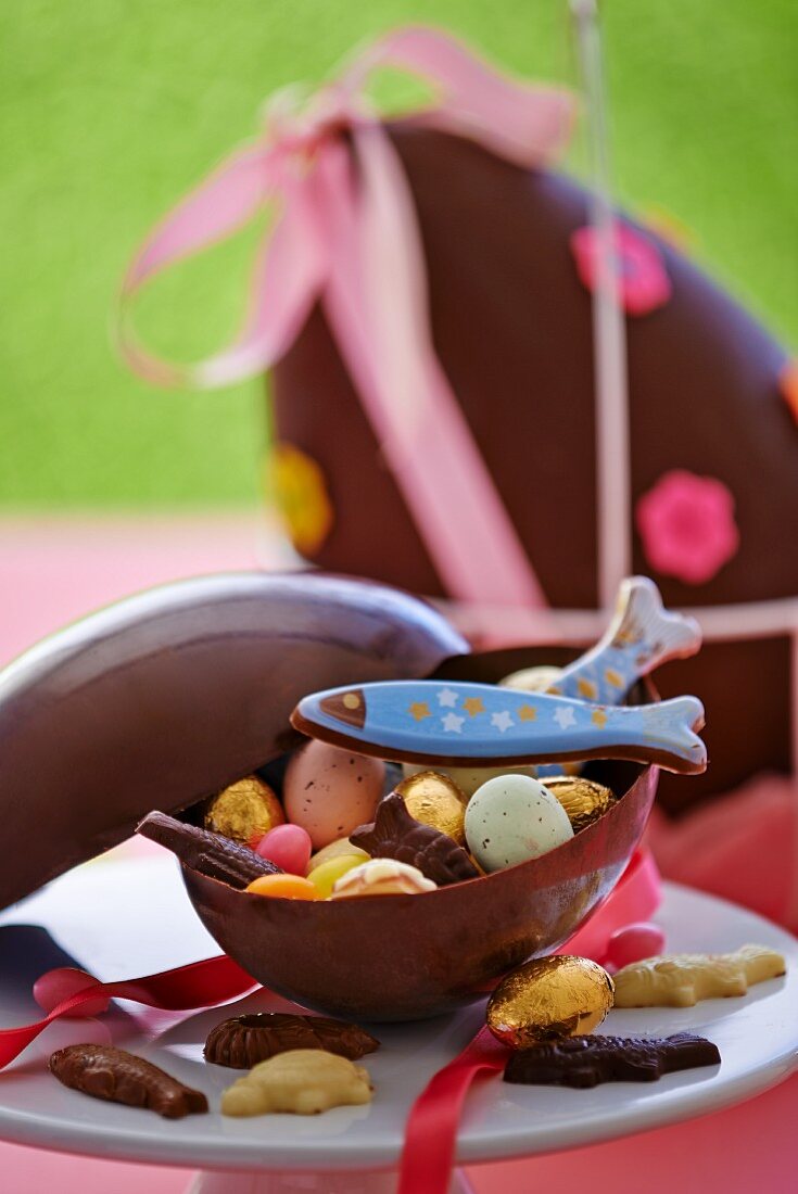 Various Easter sweets in a chocolate egg