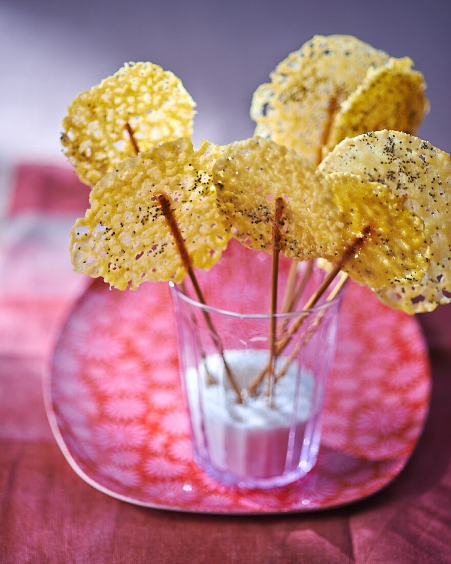 Cheese lollies with poppyseeds in a glass