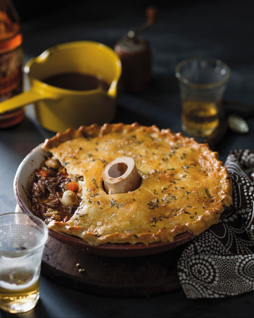 Boeuf Bourguignon pie with a bone