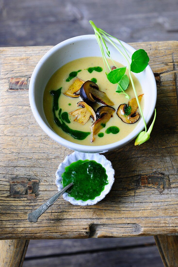Potato soup with mushrooms and watercress