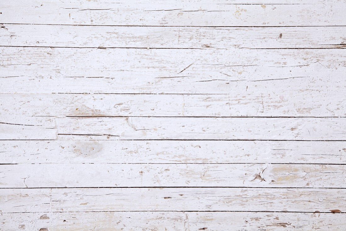 A surface of white-painted wooden boards