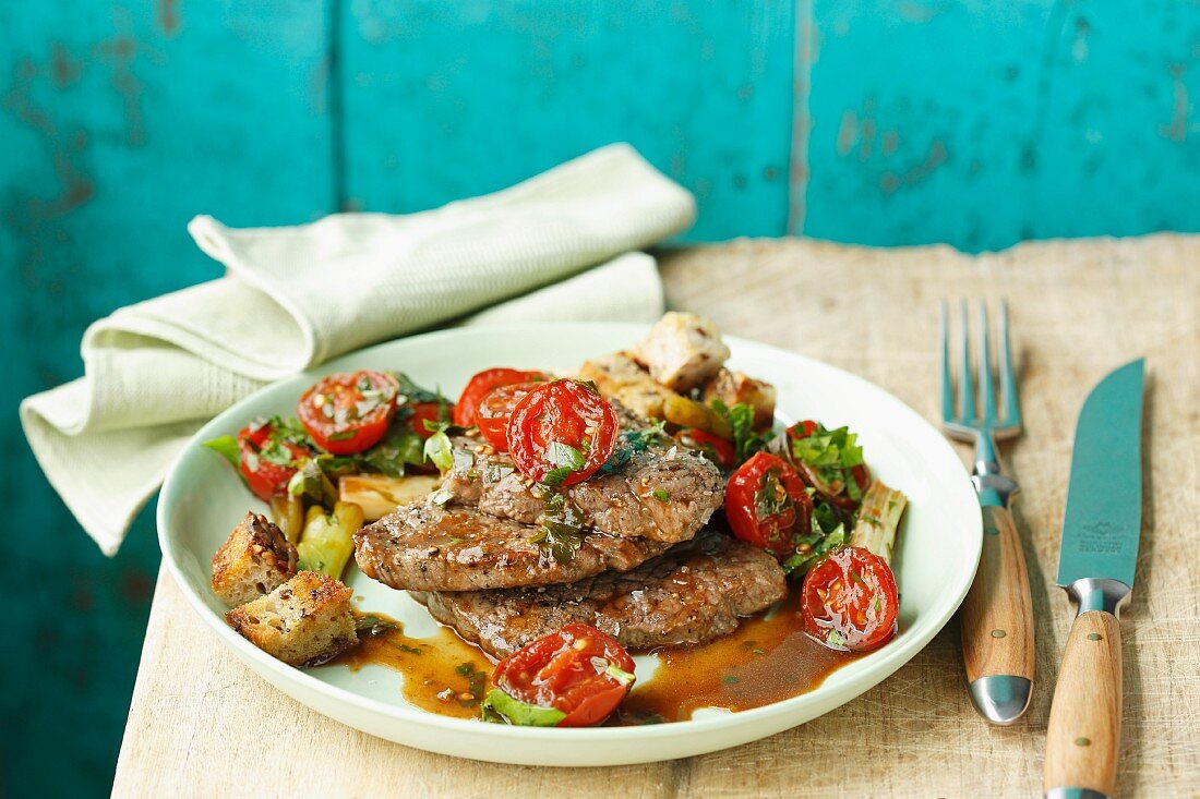 Beef fillet with braised cherry tomatoes and fresh herbs