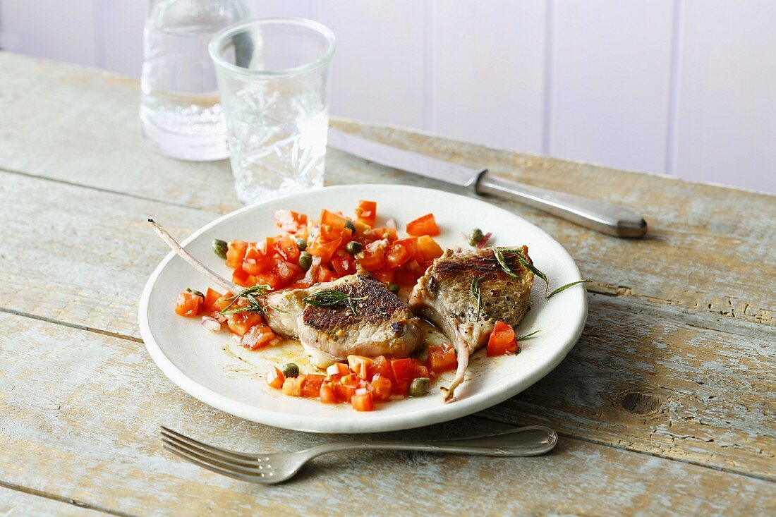Fried lamb chops with a tomato and caper salsa