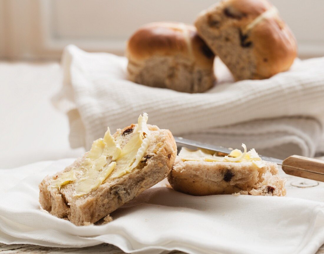 Hot cross buns, one buttered