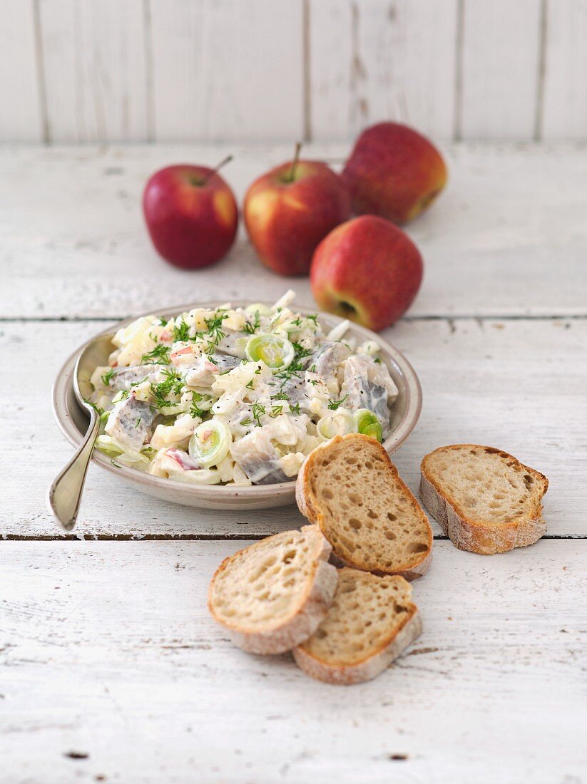 Herring salad with apple, leek, onions and sour cream