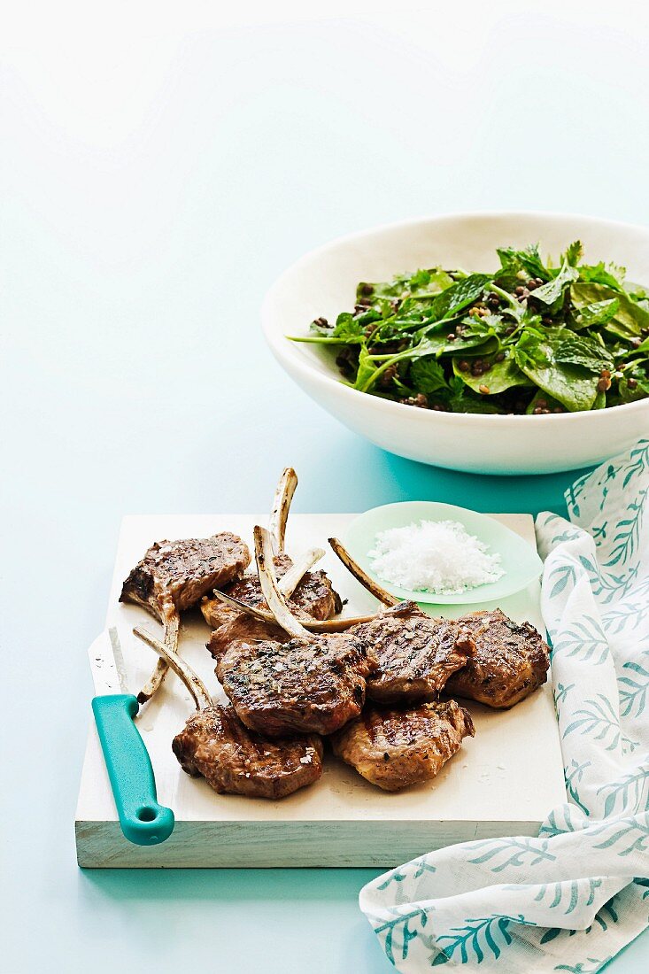 Grilled lamb chops with spinach and lentil salad