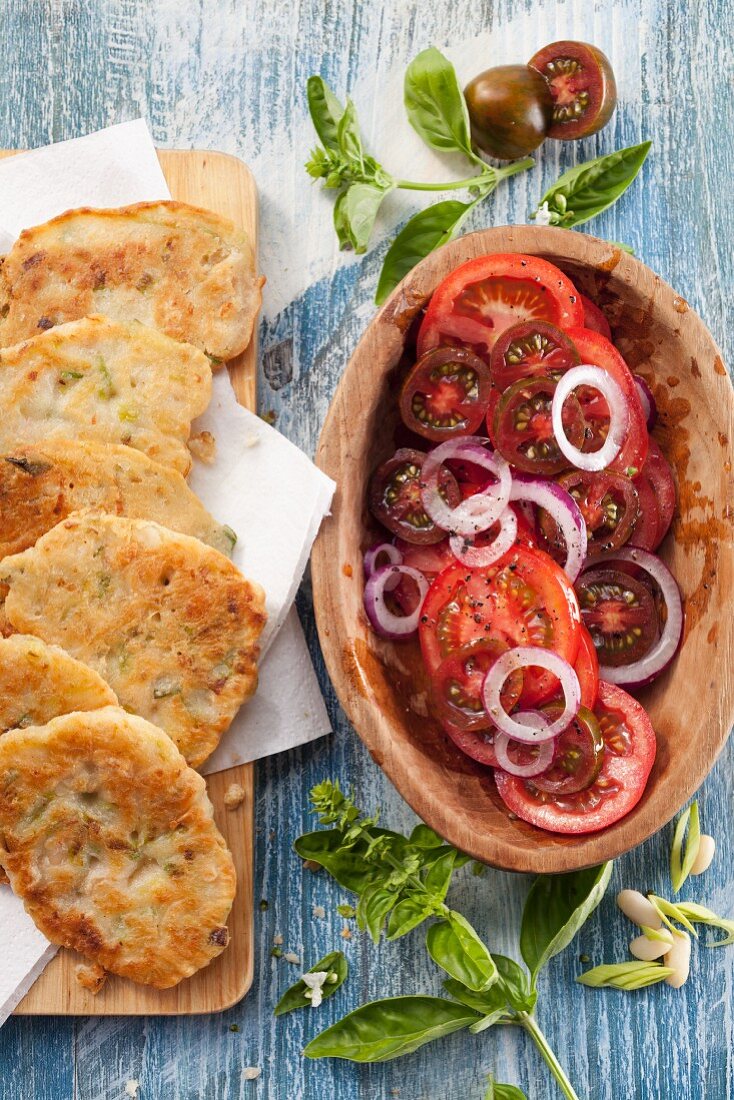 Leek and bean fritters with tomato salad