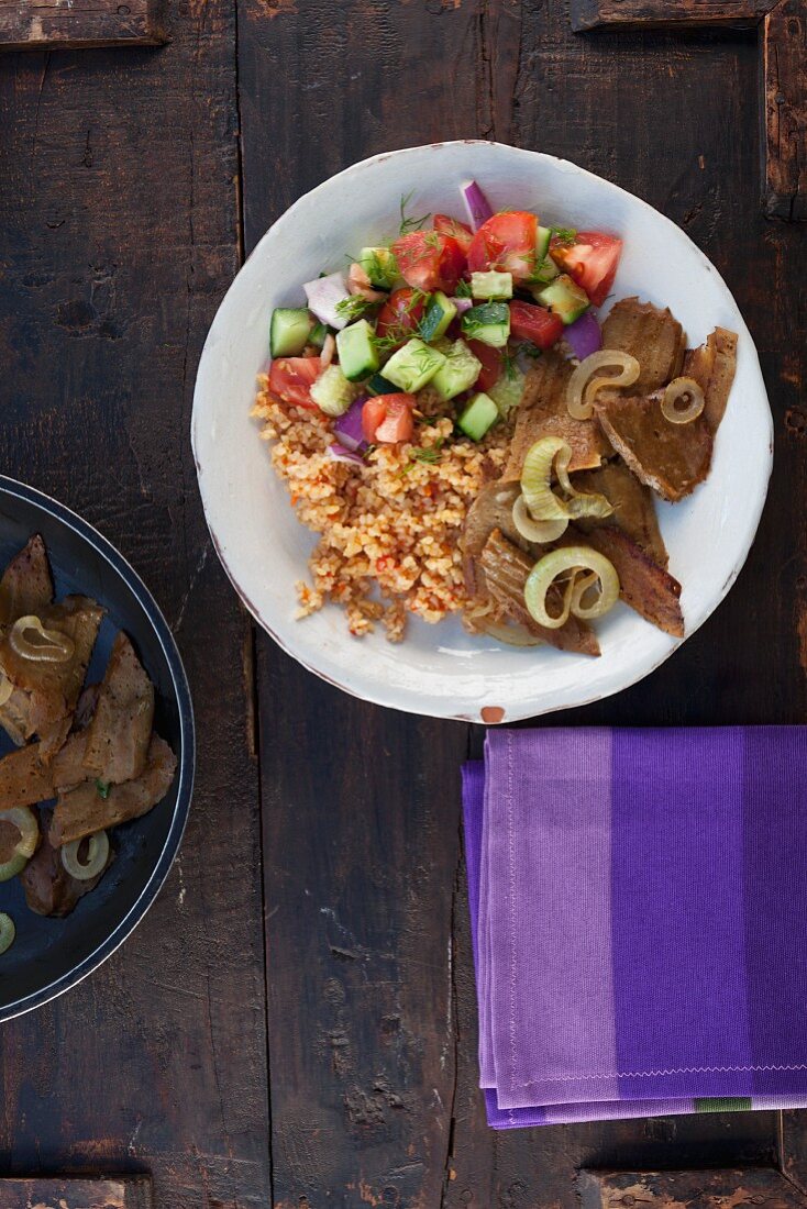 Vegetarian seitan kebabs with tomato bulgur and a salad