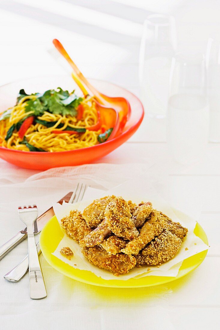 Chicken fillets with sesame crust and hokkien noodle salad