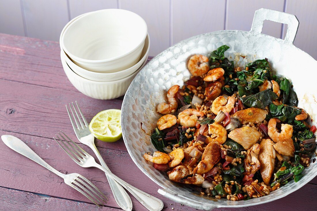 Quick chard and spelt stir fry with turkey escalope and shrimps