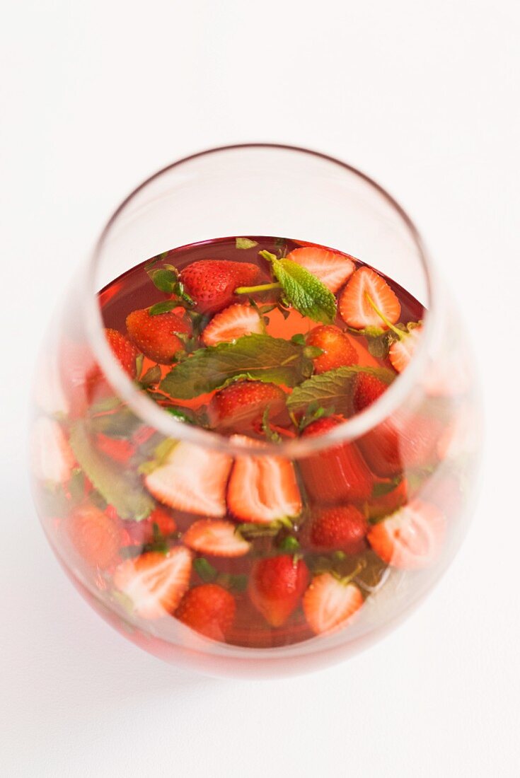 Sangria with strawberries and mint in a glass