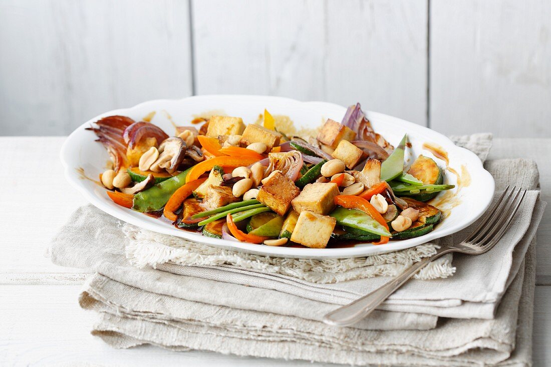 Stir-fried vegan vegetables with tofu and peanuts