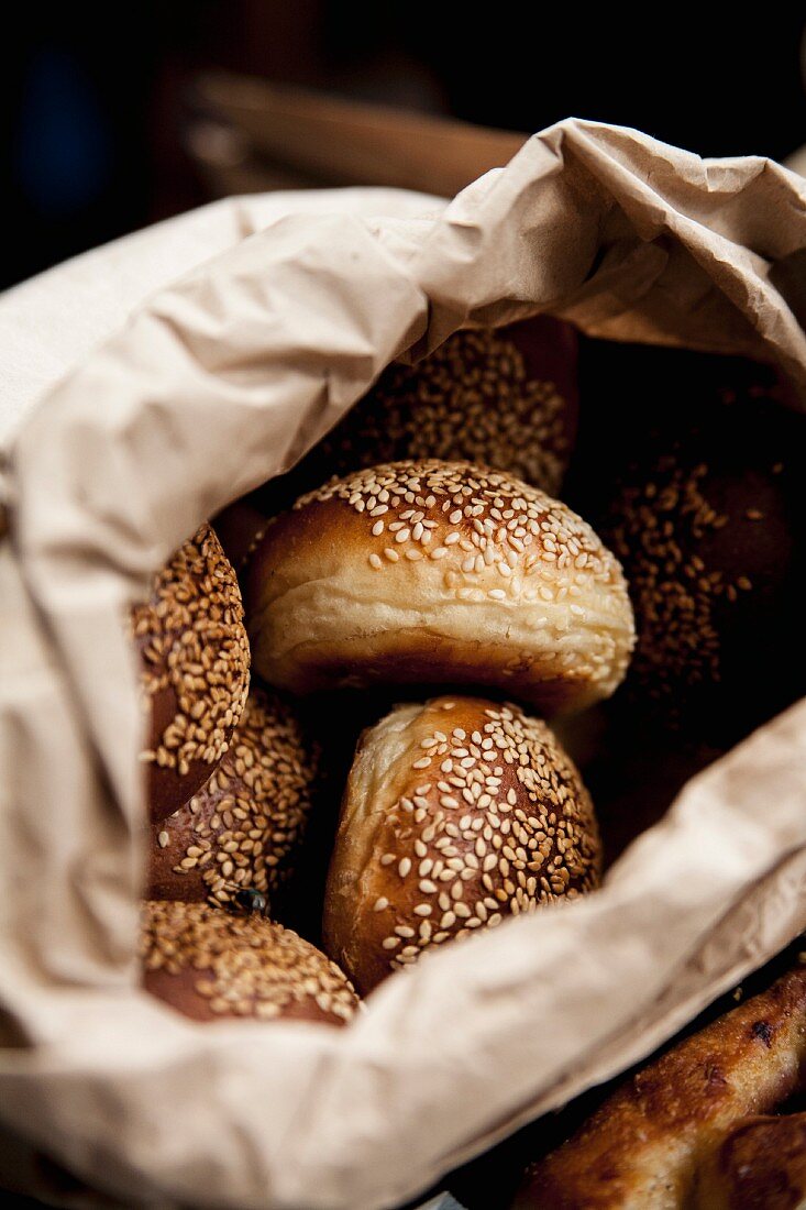 Sesame seed rolls in a bread bag