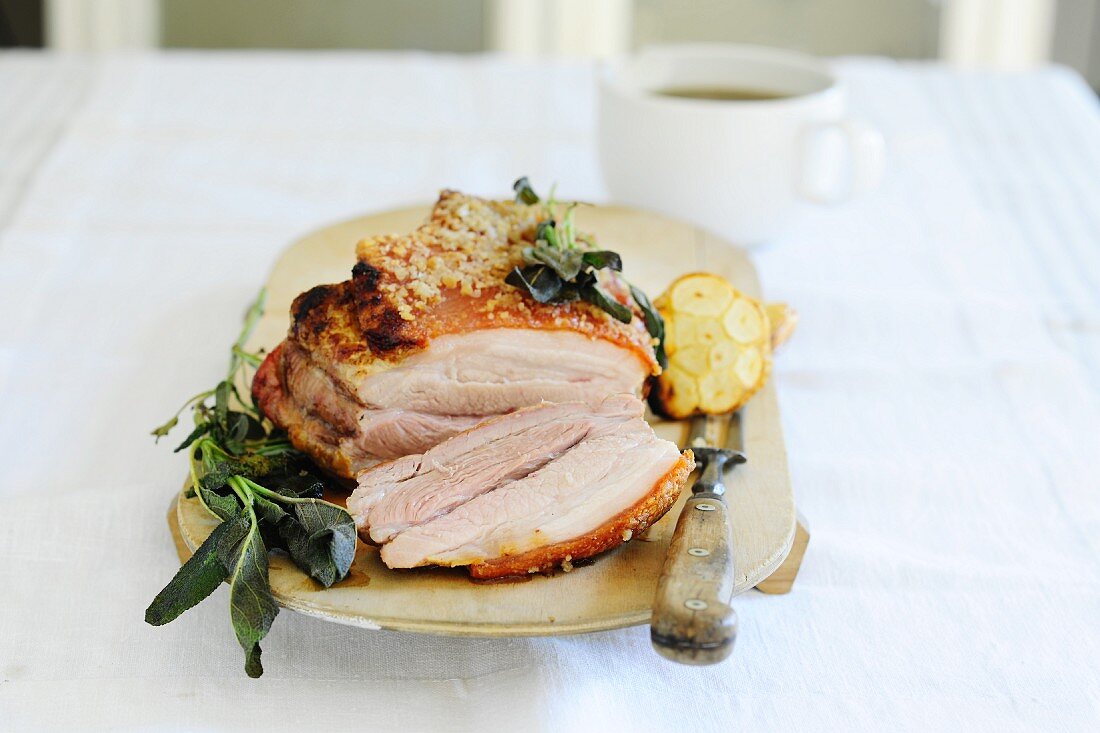 Roast pork with sage and garlic, sliced