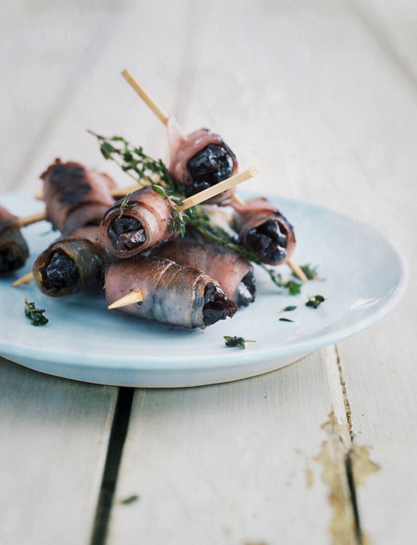 Prunes wrapped in bacon with time