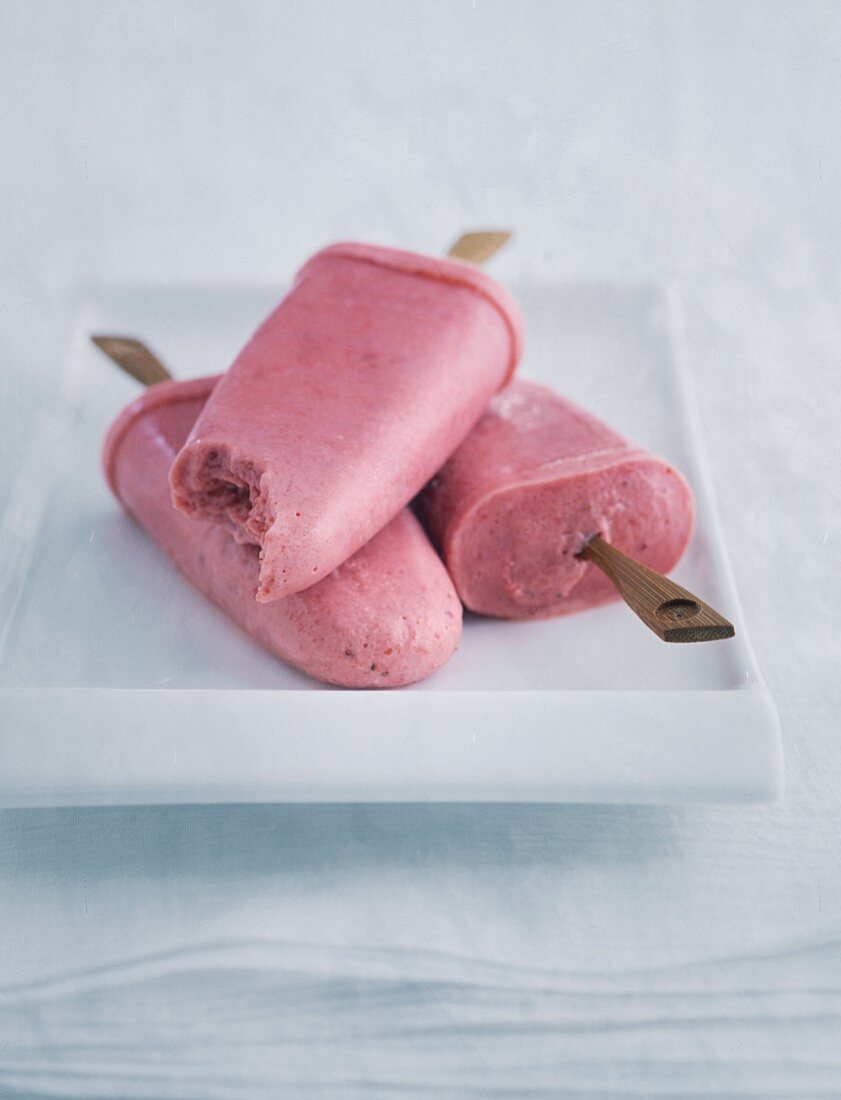 Strawberry ice cream on a white porcelain plate