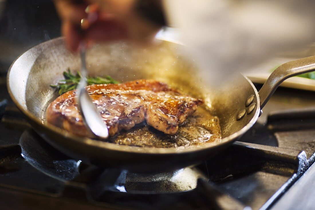 Fried beef steak in a pan