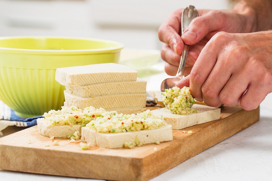 Oven-roasted tofu with a herb and lime crust being made