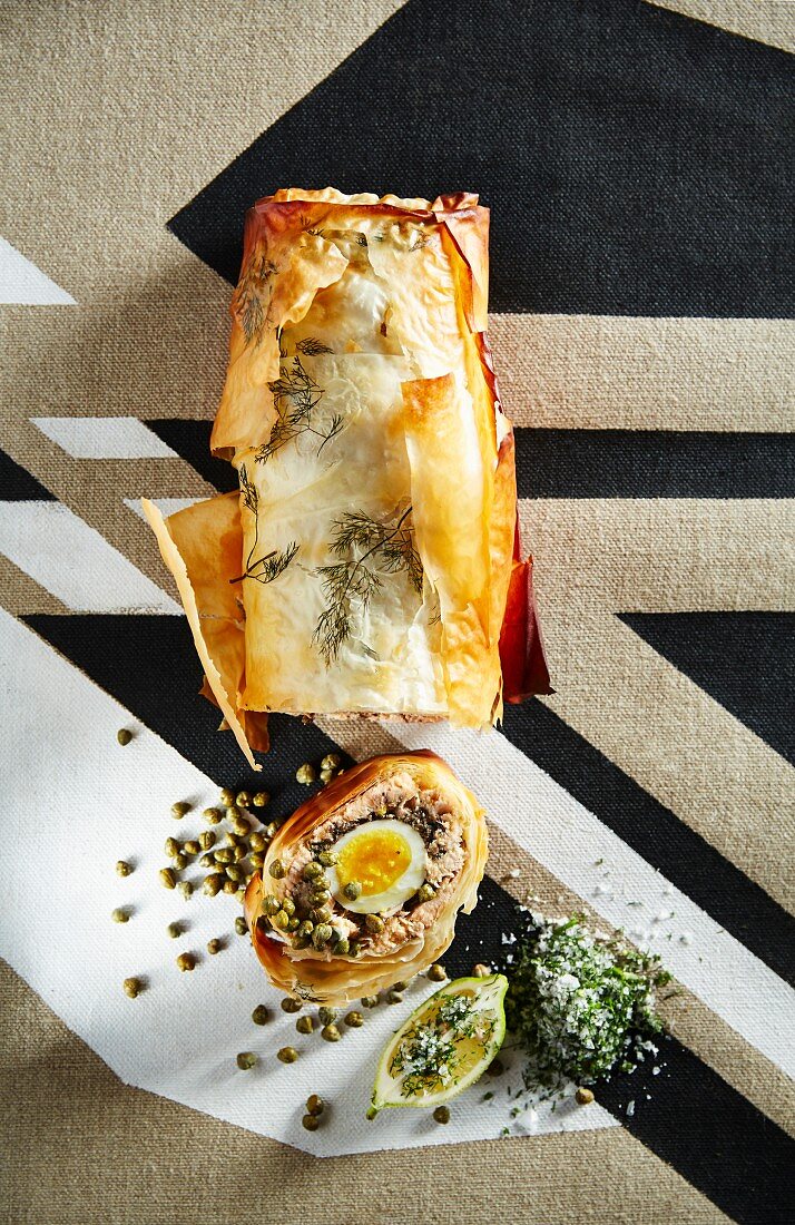 Salmon strudel with mushrooms, egg and capers