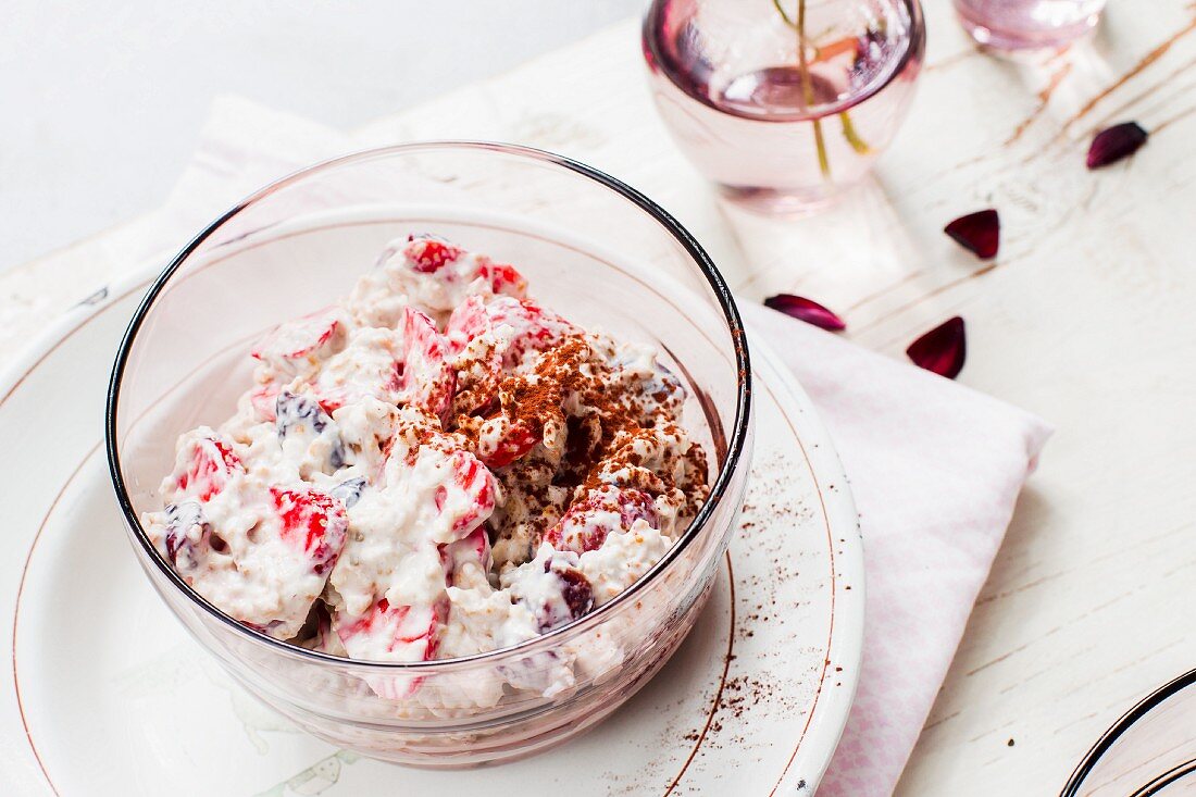 Freshly made muesli with yoghurt and strawberries