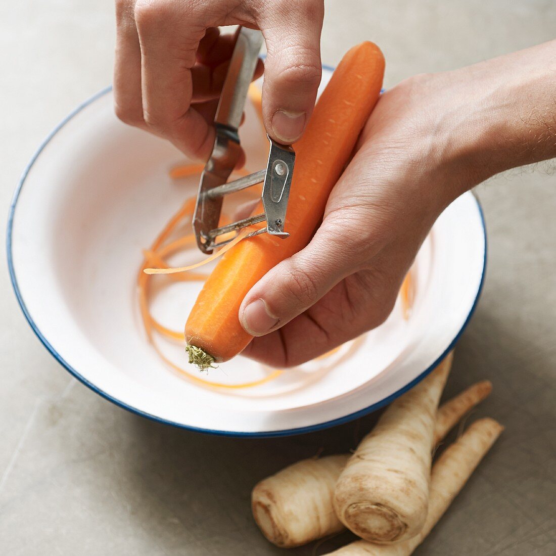 A carrot being grated