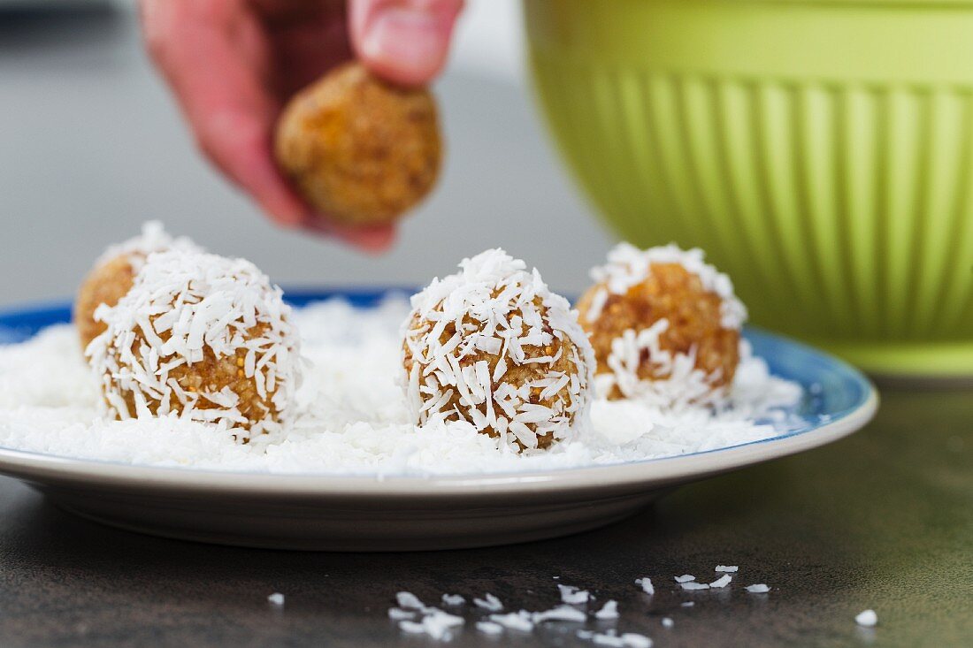 Energy balls made from dried fruits rolled in coconut