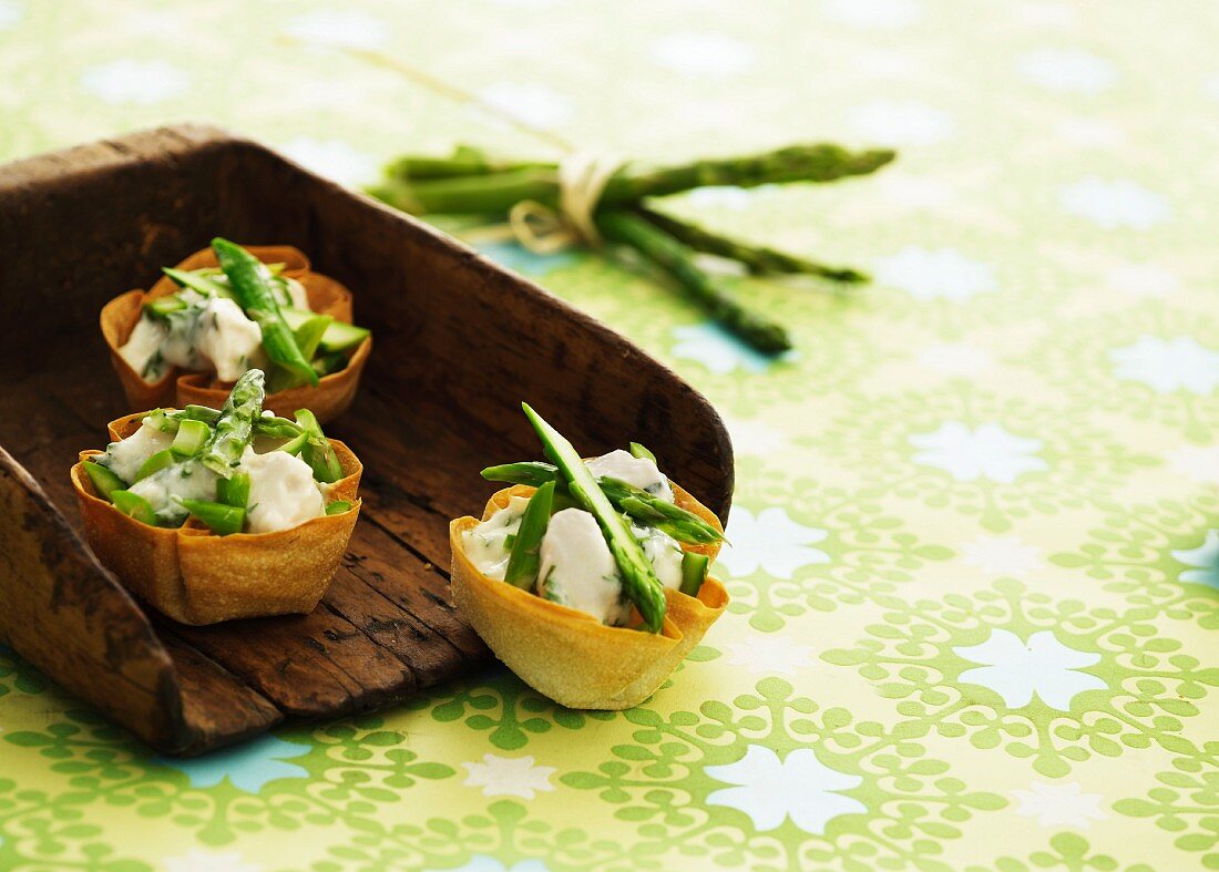 Pastry shells filled with asparagus salad