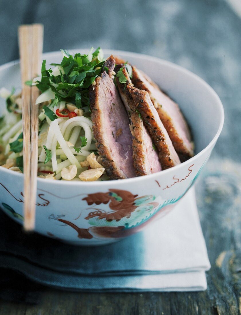 Kohlrabi salad with peanuts and fried duck breast