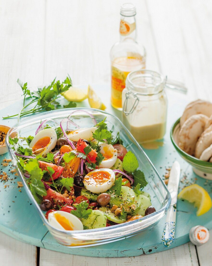 A salad with hard-boiled eggs, tomatoes and breadcrumbs