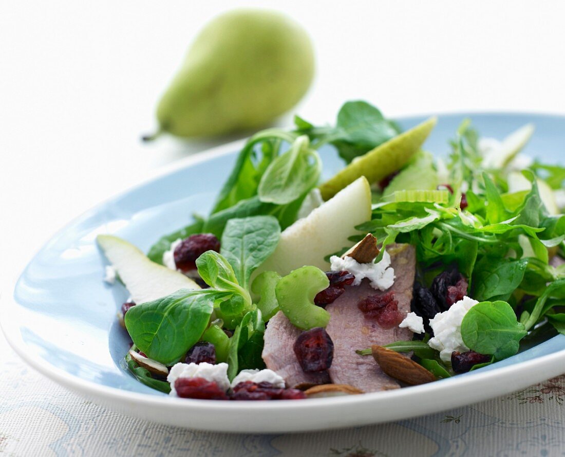 Lamb's lettuce with veal, pears, cranberries, almonds and feta cheese