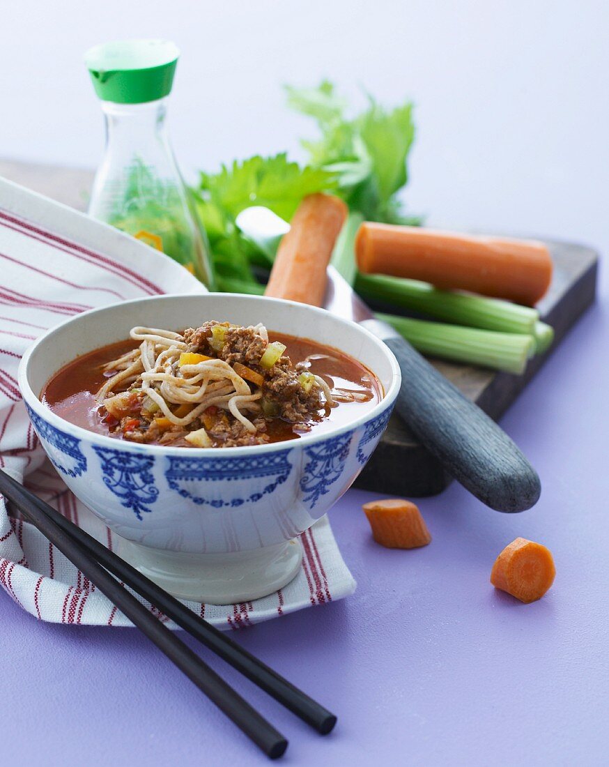 Beef soup with noodles, carrots and celery (Asia)