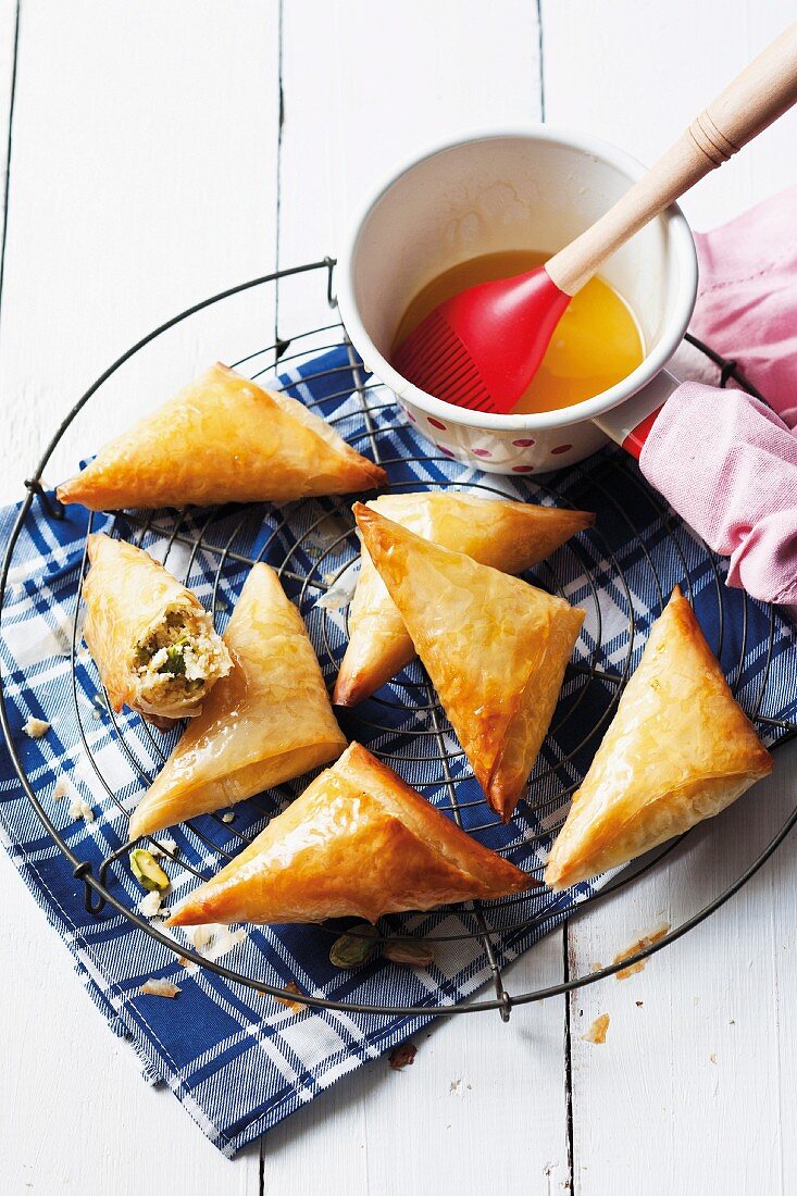 Filo pastry pasties filled with ricotta and honey