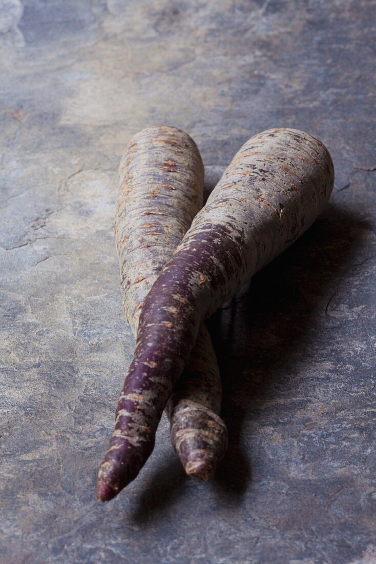 Two purple organic carrots