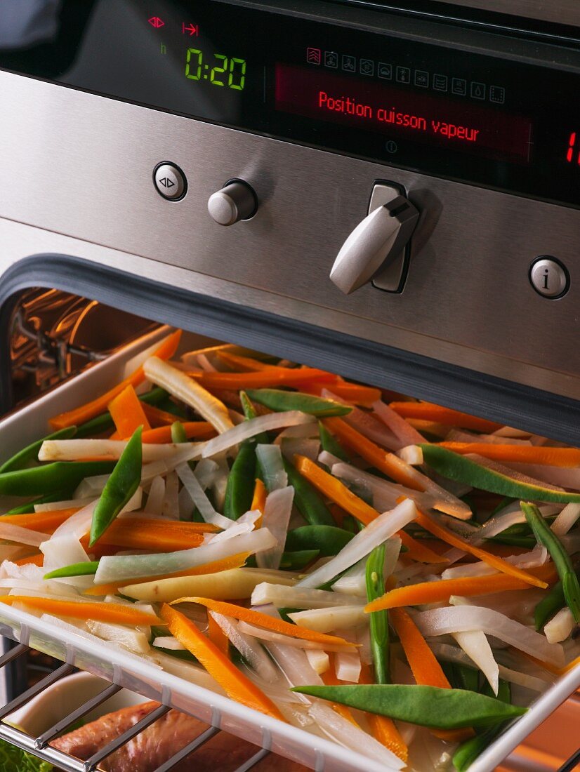 Steamed vegetables in an oven