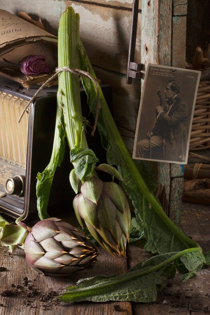 A rustic, nostalgic arrangement featuring fresh artichokes