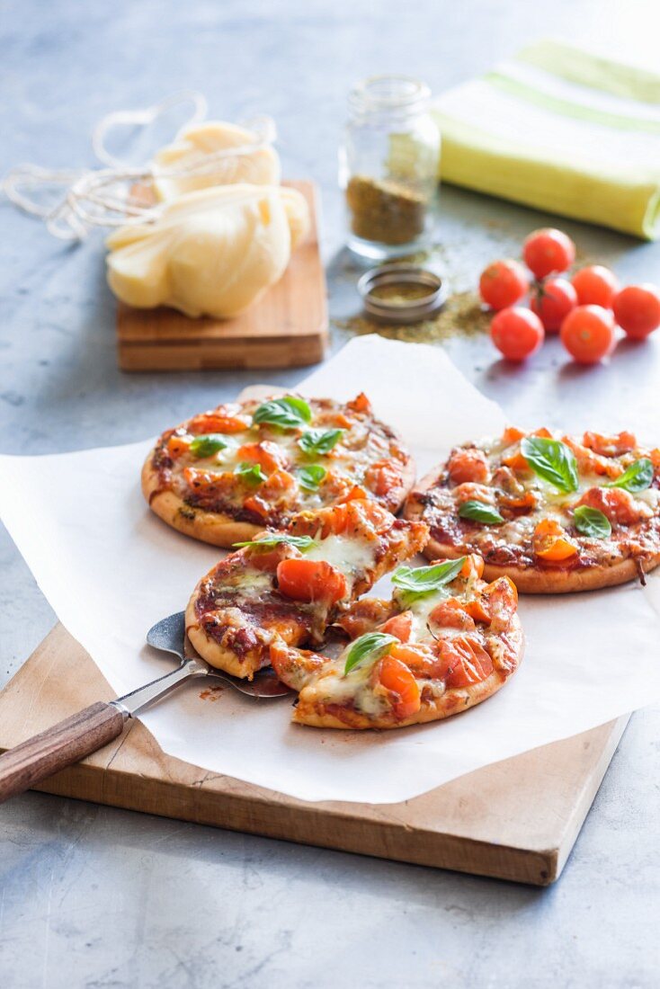 Mini pizzas with cherry tomatoes and mozzarella