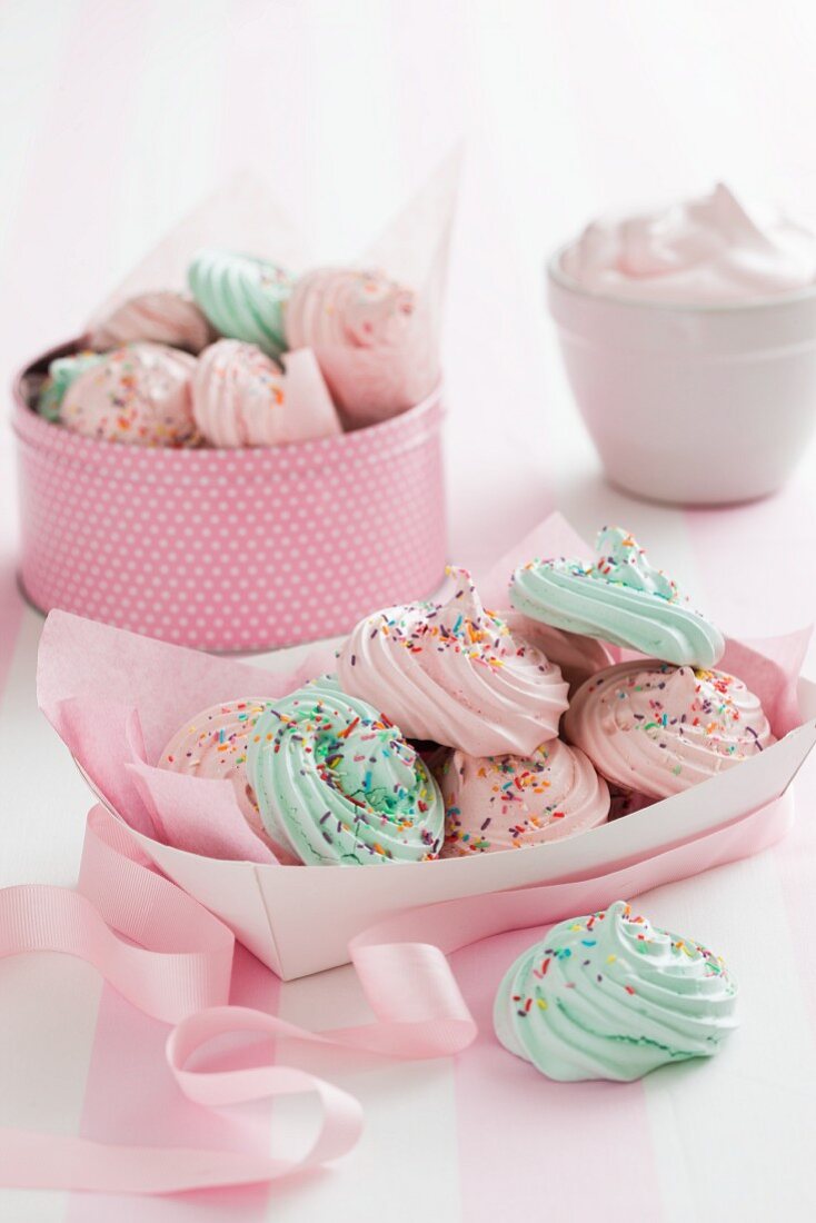 Pastel coloured meringues with sugar sprinkles