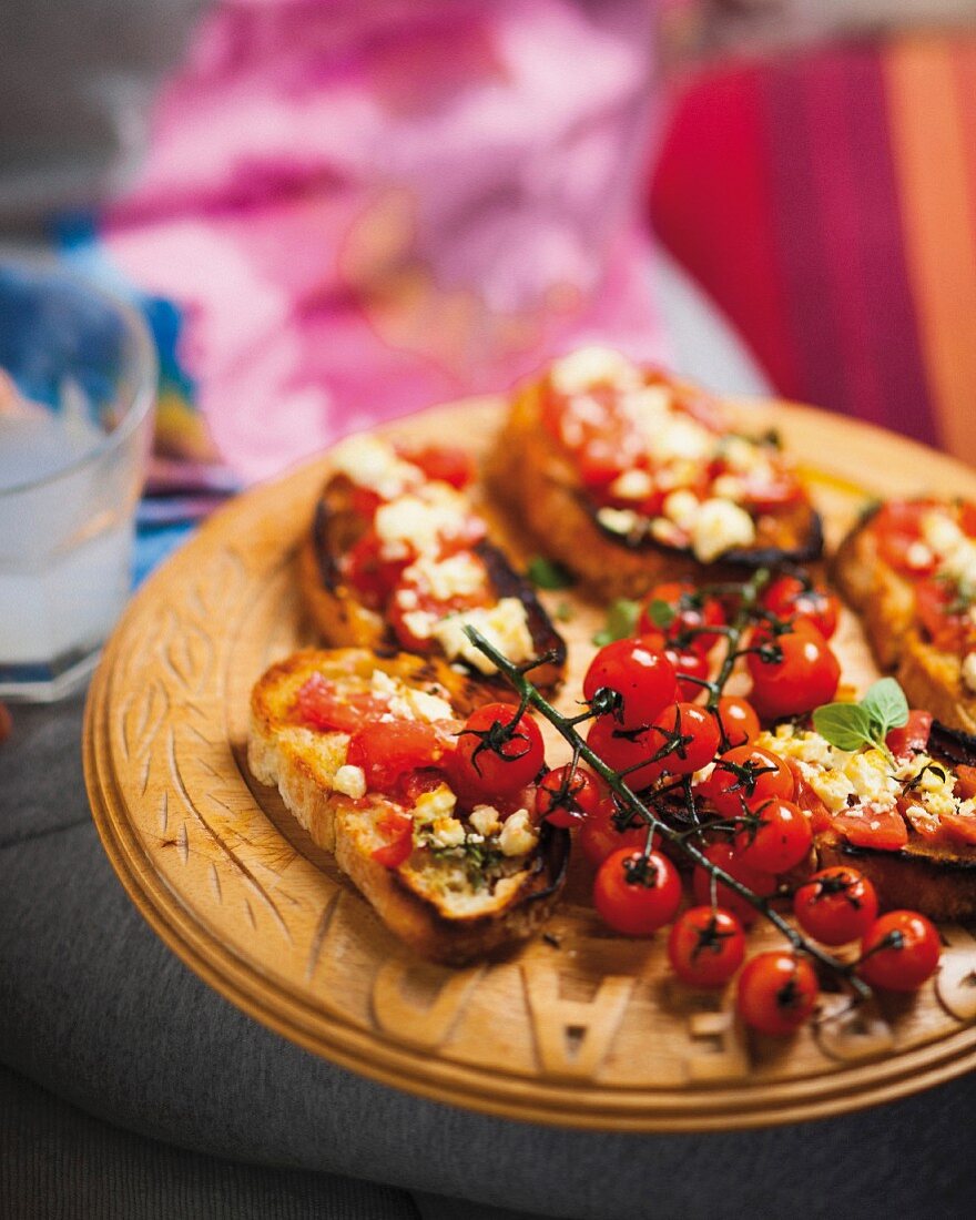 Greek style toast topped with tomatoes, oregano and feta cheese
