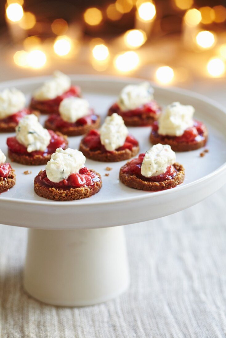 Oatcakes topped with tomato relish and cream cheese