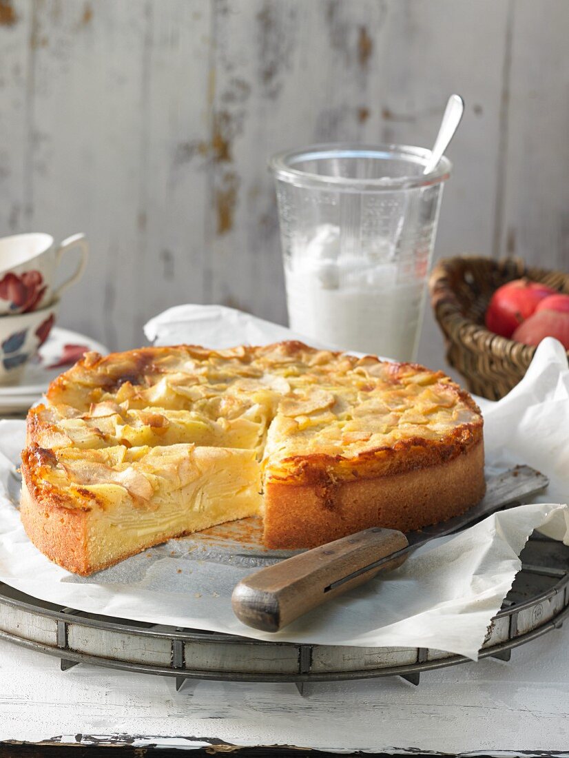 Apple layer cake, sliced, on a wire rack