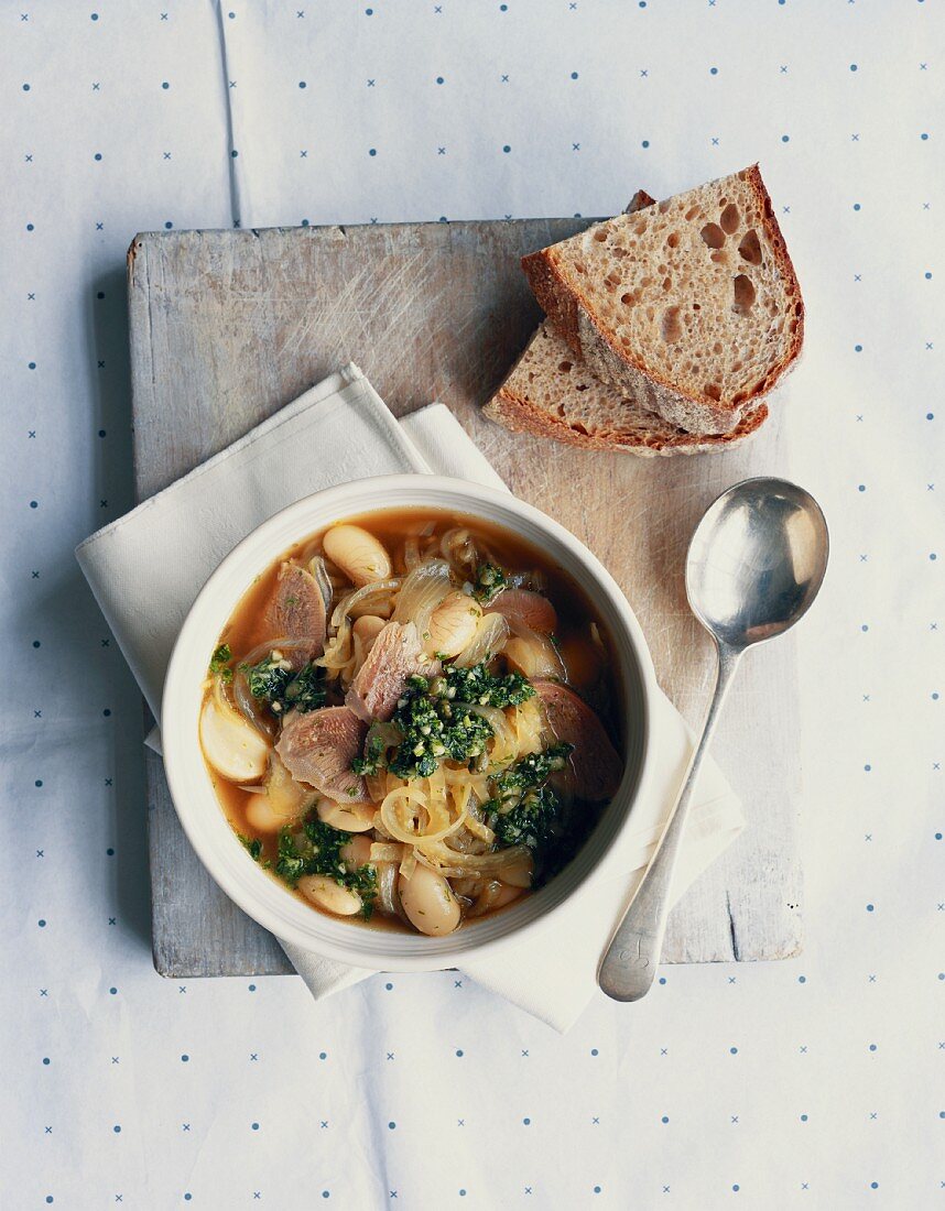 Ox tongue soup with fennel, beans and a herb sauce