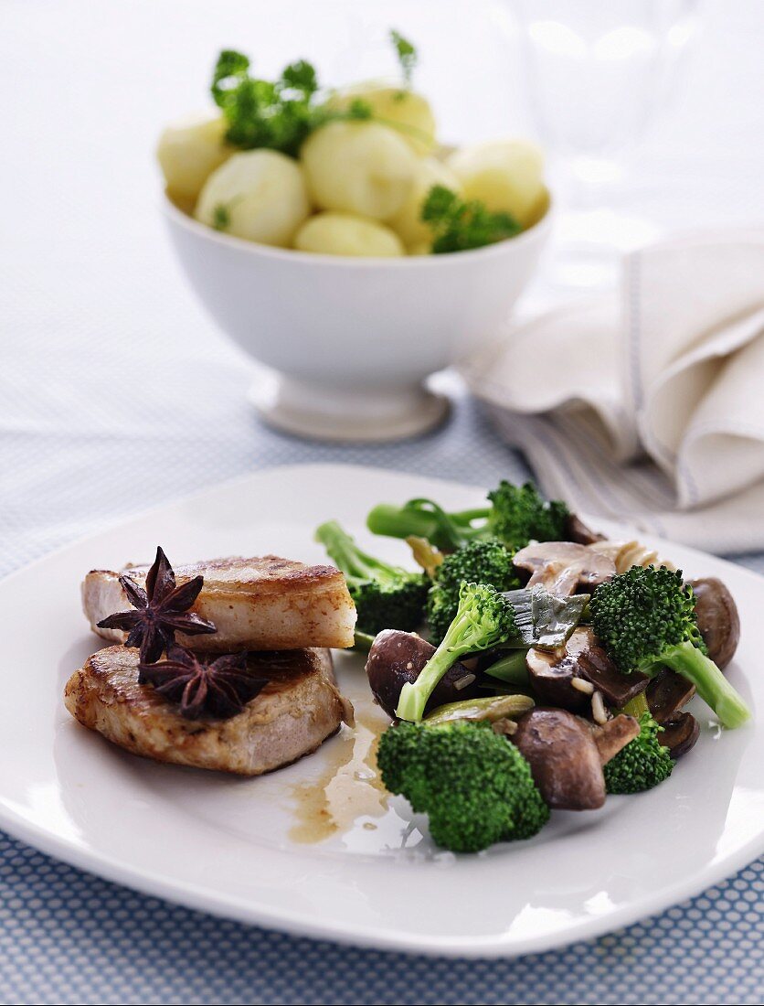 Pork steak with star anise, mushrooms, soy sauce and broccoli florets