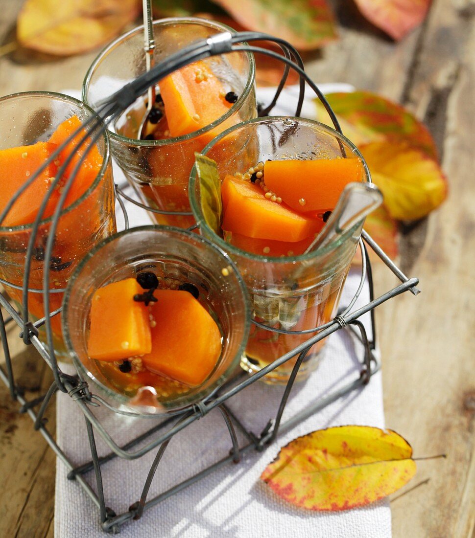 Spiced sweet and sour pickled pumpkin in glasses