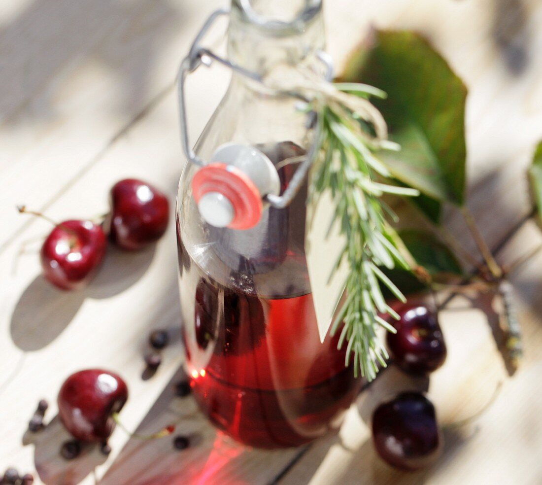 Homemade cherry vinegar with rosemary