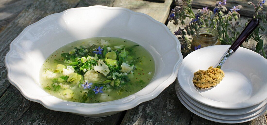 Green summer soup with olive paste