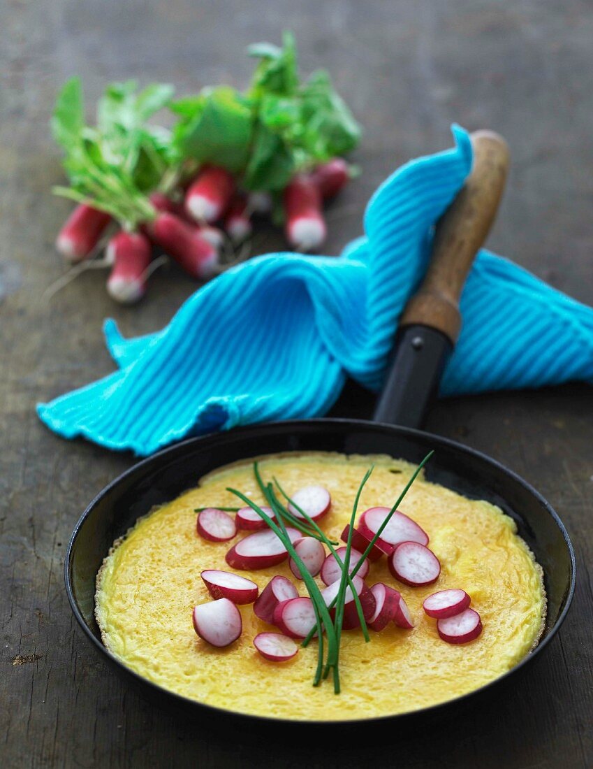 An omelette with radishes and chives