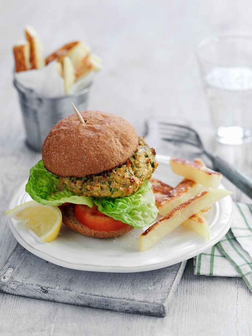 A vegetable burger with tomatoes and lettuce